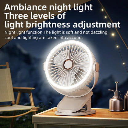 White portable fan with night light feature on a wooden surface at night.
