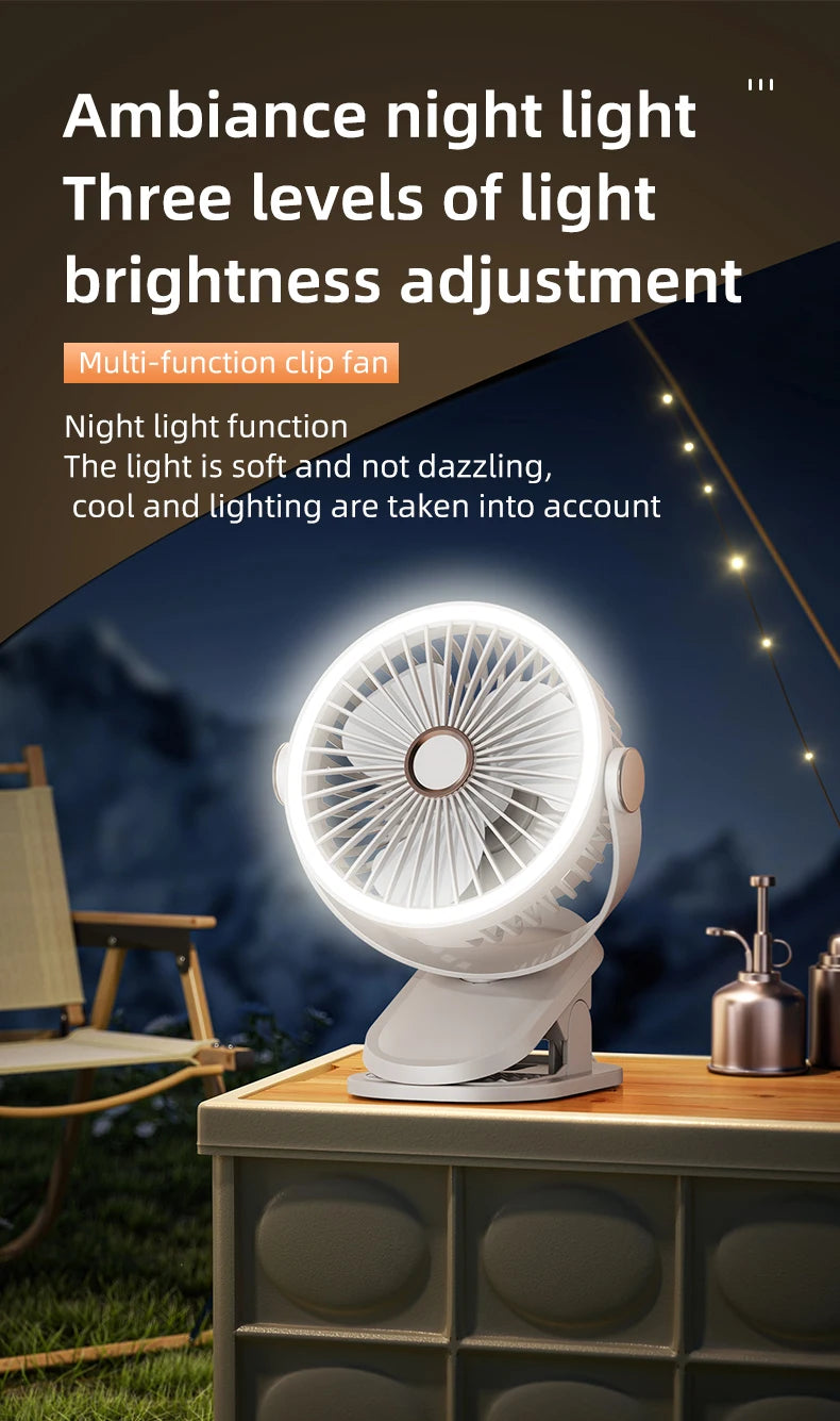White clip fan with night light feature on a wooden surface at night.